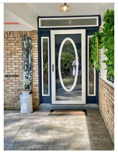 Hand-painted "Welcome" sign at front entrance