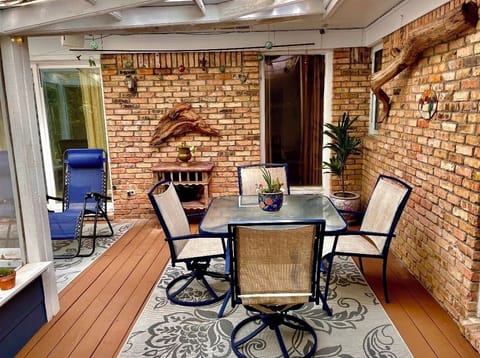 Screened deck, with doors leading to master bedroom and dining room