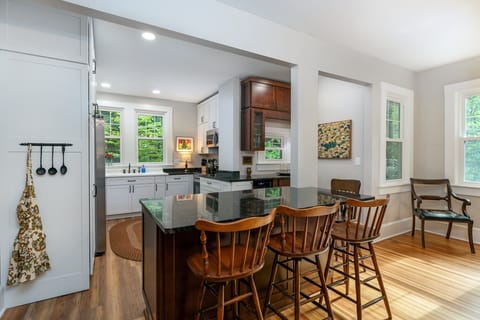 All new kitchen and appliances on the main level with bar seating for 3, dishwasher, and libation station.