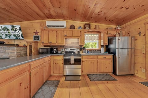 Spacious kitchen with all the cooking tools for chefs to create meals at the cabin. Glass and plastic dishes available.