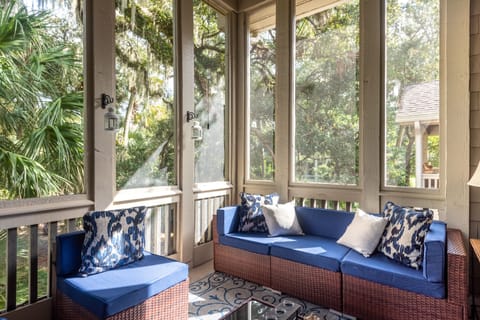 The screen porch is the perfect spot for morning coffee or afternoon cocktail time.