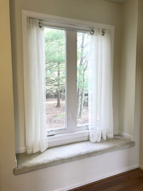 Bedroom #1 - queen, on the first floor, walk-in closet, window bench