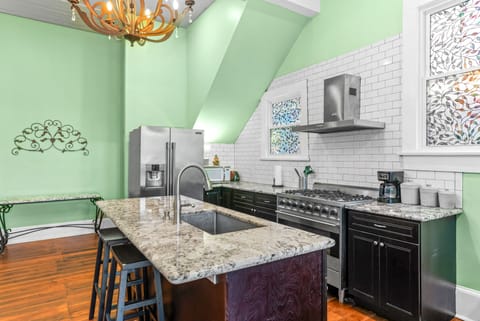 Kitchen is well stocked: microwave, ninja blender, ice maker, toaster, dishes...