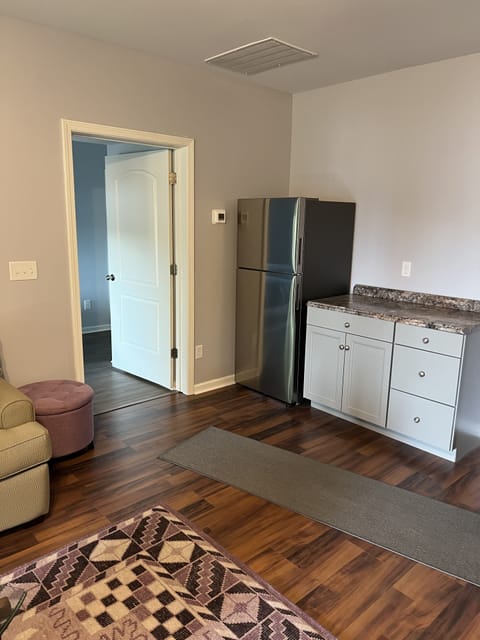 Family room on 1st floor with refrigerator and space to chill