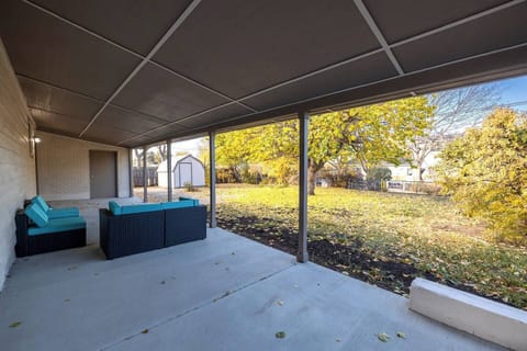 - Spacious covered patio opens to a large backyard with cozy lounge seating and privacy
- Ideal for morning coffee or evening drinks while soaking up views of the trees
- Shade and open space combine to create a perfect indoor outdoor transition