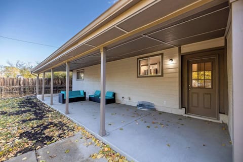- Relax on the shaded patio with turquoise cushioned seating and a peaceful backyard view
- Overhead cover provides comfort in any weather for lounging, reading, or sipping wine
- Great for enjoying fresh air or winding down after a day of adventure