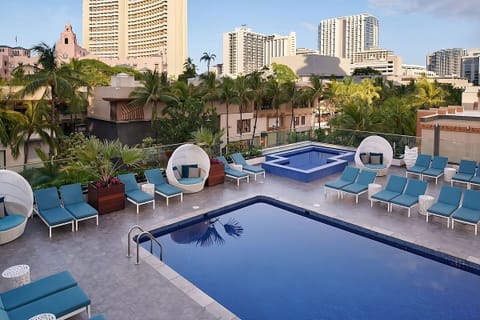 Stretch out poolside with palms, cabanas, and open skies.