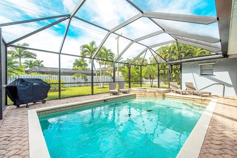 Private Heated Pool and Spa with propane grill and four lounge chairs