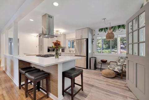 The kitchen has some seating around the island and a cool "leaf" chair with ottoman to relax and enjoy the outdoors.