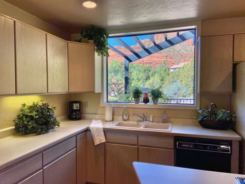 Full kitchen with new ceramic pots and pans.
