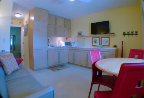 View to the kitchen area with built in refrigerator cabinet