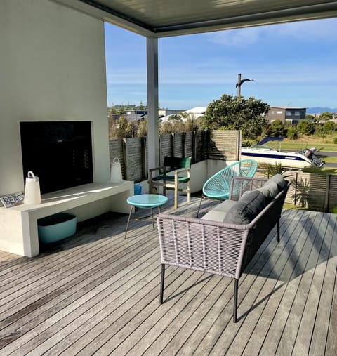 Large outdoor fire (with built in pizza oven) under Louvre roof shelter/shade.