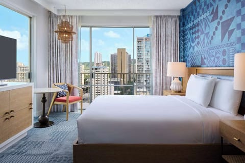 Wake up to wide windows and a breezy balcony outlook.