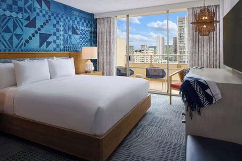 Wake up in a serene king room above the city.