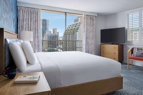 Unwind in crisp linens with sweeping city views.