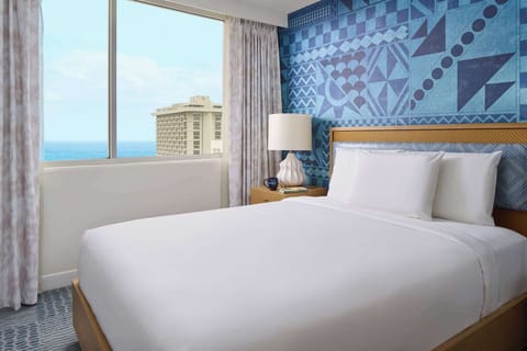 Drift off to ocean glimpses from crisp, cloud-soft bedding.
