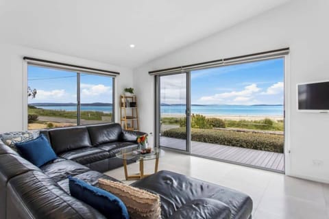 Bask in the breathtaking panoramic ocean views from this spacious living area, designed to make the most of the coastal setting.
