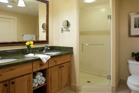 Bathroom with 2 sinks and separate shower and tub.