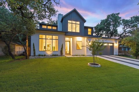 Front of this beautiful two-story house at night