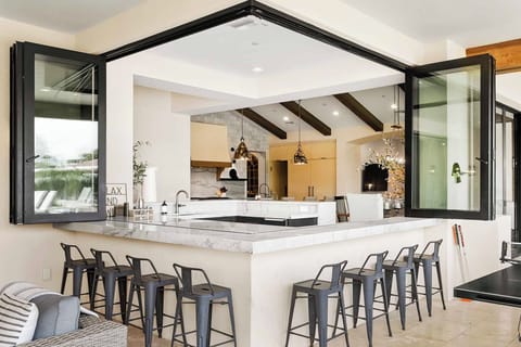 Stunning indoor/outdoor bar with seating