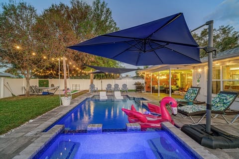 Float on a flamingo while cooking on the BBQ with the family.