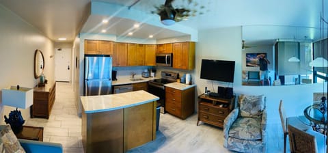 Stainless appliances, flat top stove.