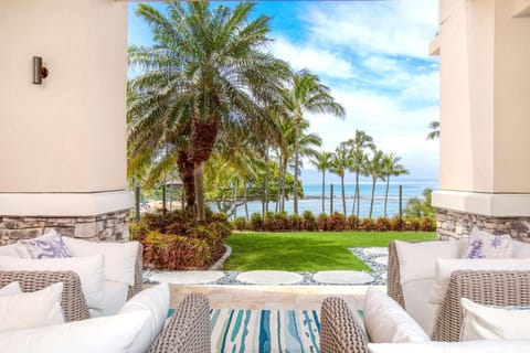 Beneath sunlit fronds and coastal calm, elegance meets ease