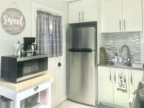 kitchen, refrigerator, microwave and sink