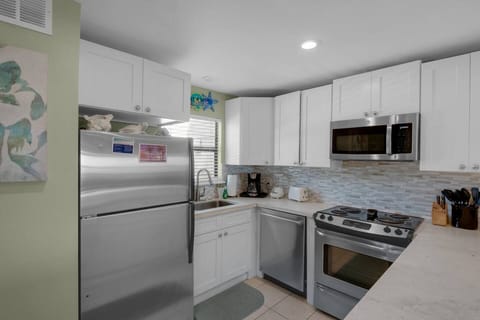 Recently remodeled kitchen has stainless appliances and new countertops - fully stocked to prepare meals in your home away from home