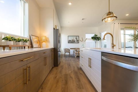 A massive farmhouse sink and cabinets full of all the different luxuries you can imagine.