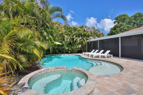 Spacious outdoor paradise with heated saltwater pool and spa, fire pit, lounge chairs and more!