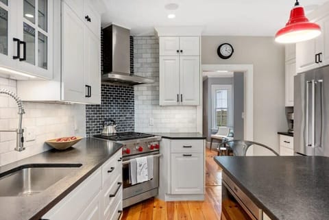 Ground level kitchen with all major appliances and 4-person eat-in island