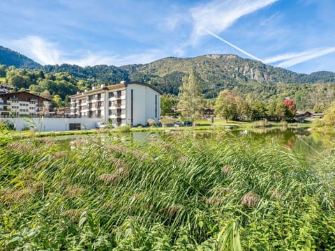 Sky, Cloud, Plant, Building, Mountain, Natural Landscape, Land Lot, Flower, House, Bank
