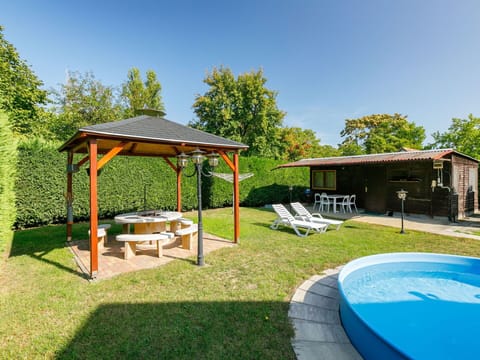 Plant, Sky, Nature, Shade, Tree, Outdoor Furniture, Swimming Pool, Land Lot, House, Building