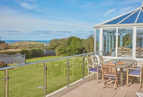 Seawynds, Trelights. Large garden and patio area to the rear of property with sea views