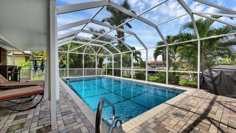 Beautiful lanai and pool overlooking canal