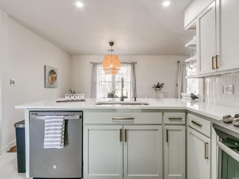 Kitchen opens to eat in bar and dining spaces