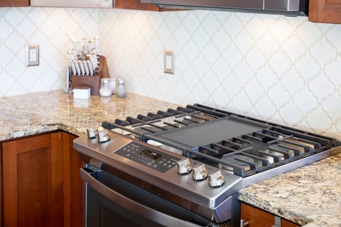 Gas convection range with griddle and air fryer.