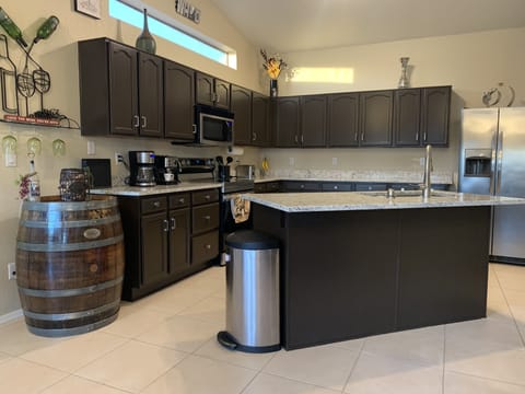 Remodeled kitchen with granite counter top and new fixtures.