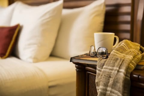 Settle in with a warm drink and bedside essentials nearby.