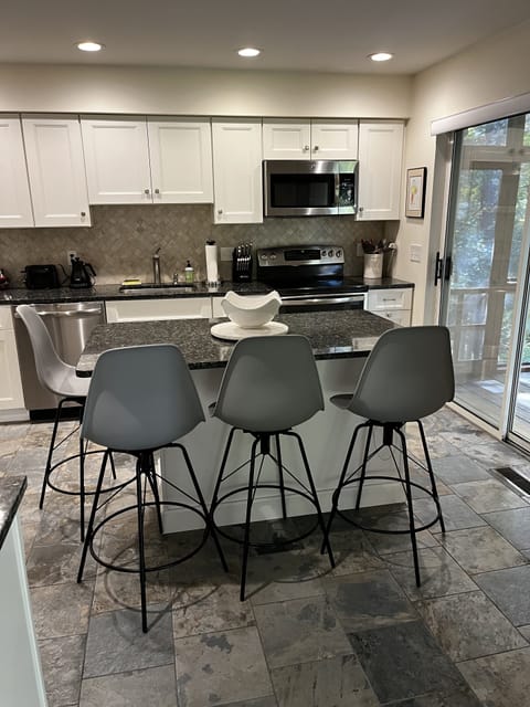 Kitchen with island and bar stools