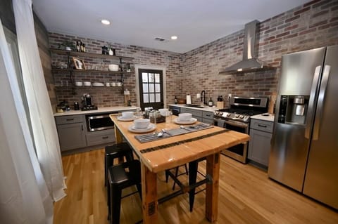 Exposed brick and industrial style kitchen with all new LG appliances.