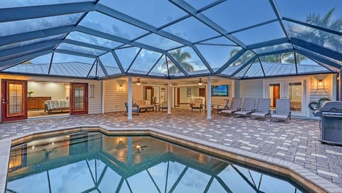 Screened-in pool and patio. Chaise lounges for soaking up the sun.  Sliding glass doors to bring the outside in including the tropical breezes.