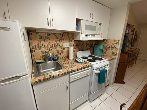 Dishwasher, oven, stove, and full size refrigerator, coffee pot and Keurig.