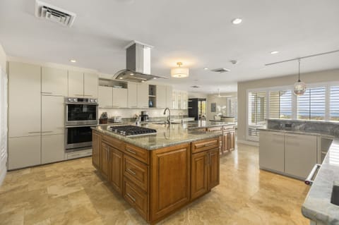 Cook with ease in this chef-inspired kitchen featuring a central island.