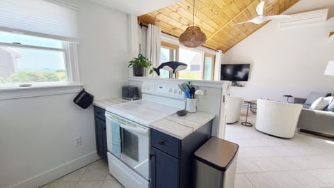 Nicely equipped kitchen opens to dining area and living room