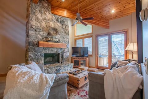 Wood burning fireplace and balcony overlooks Deer Valley. 