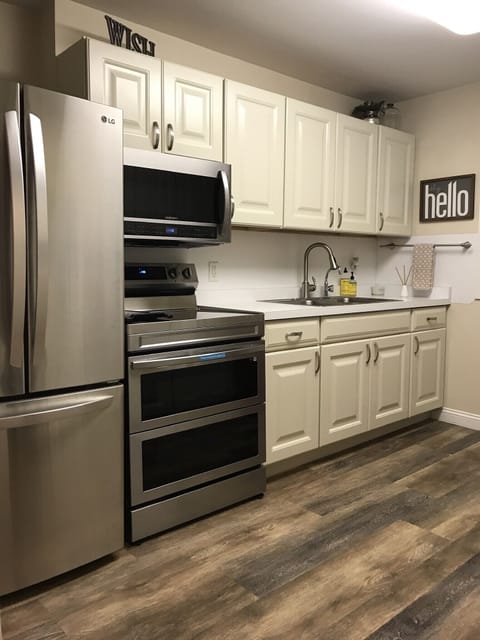 Main kitchen with new appliances including a Samsung double oven with air fryer.