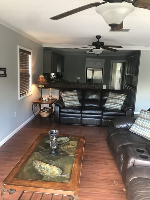 Different view of living room and kitchen.
