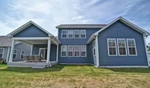 Backyard area includes gas grill (and cooking tools).